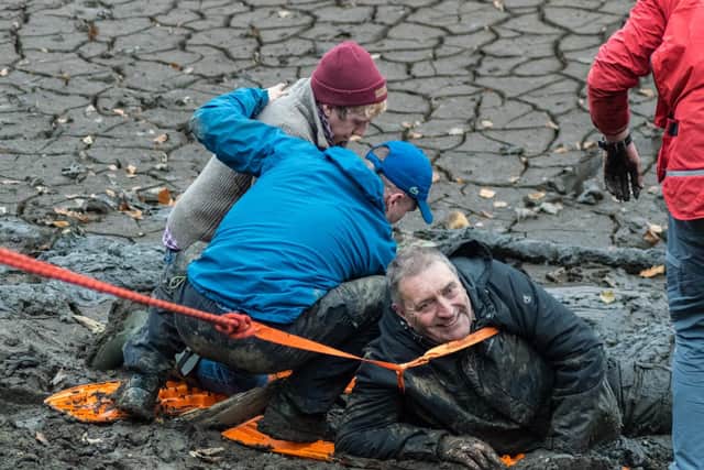 Pictures show rescue mission after man gets stuck waist deep in mud at ...