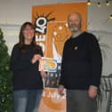 Catherine Webb with her winning artwork for the Fringe 2019 cover alongside Fringe chair Keith Savage.