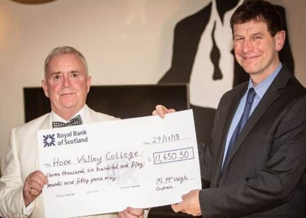 Michael McVeigh, Sickleholme Golf Club captain, presents cheque to Hope Valley College headmaster Paul Dearden for the charity Cardiac Risk in the Young.
