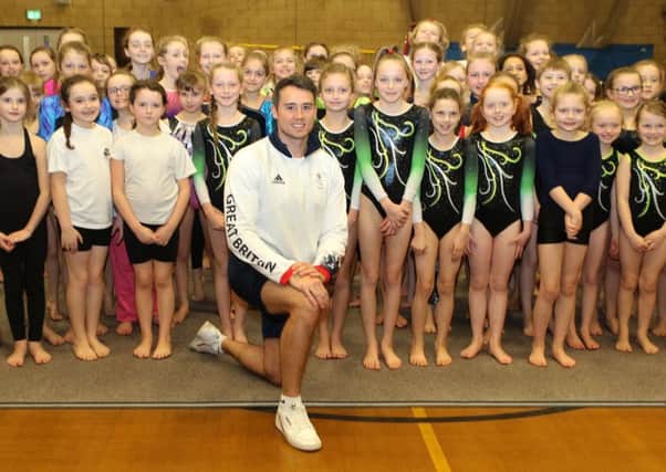 Olympic gymnast Kristian Thomas with youngsters from primary schools across High Peak at an afternoon of activities at New Mills Lesiure Centre