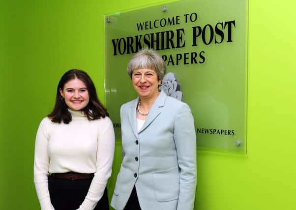 Prime Minister Theresa May with Apprentice Natasha Meek at Yorkshire Post Newspapers in February 2018.