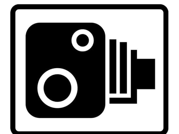 The classic speed camera warning sign