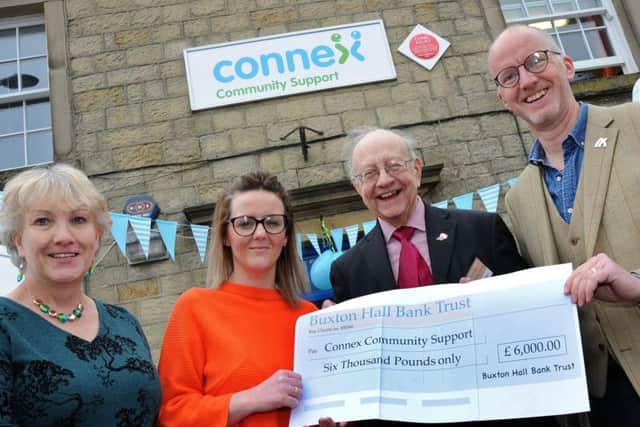 Roddie MacLean, right, and Roy Pickles, both of the Hall Bank Trust, hand over a 6,000 cheque to Rachael Mitchell, the befriending co-ordinator and chief executive Gill Geddes at the official launch of the re-branded Connex Community Support group on Friday.