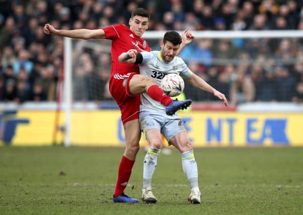ACCRINGTON, ENGLAND - JANUARY 26:  Ross Sykes of Accrington Stanley battles for possession with David Nugent of Derby County during the FA Cup Fourth Round match between Accrington Stanley and Derby County at Wham Stadium on January 26, 2019 in Accrington, United Kingdom.  (Photo by Jan Kruger/Getty Images)