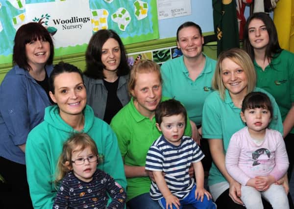 Staff at the Woodlings Nursery, in Buxton, are all smiles after receiving a good Ofsted report, pictured with managers Vicky Willetts and Amy Fraser are the deputy manager, Christine Foster, and staff Jo Cudhay, Ellie Kebbell, Kim Bones and Kerry Watson with some of the youngsters who attend the unit on Macclesfield Old Road.