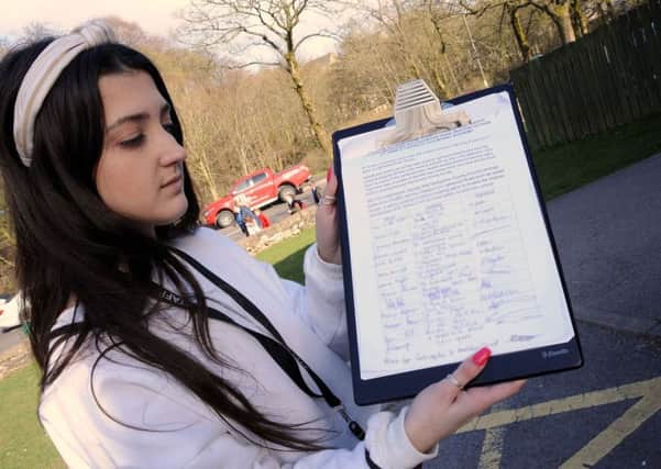 Harriet Tobias, the Pastoral Care Officer and Business Assistant at St. Anne's Primary School in Buxton, with a petition to get traffic calming measures outside the Lightwood Road school.