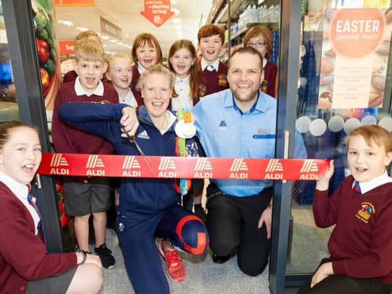 Frances Houghton cuts the ribbon to officially open the new Aldi store in Bakewell.