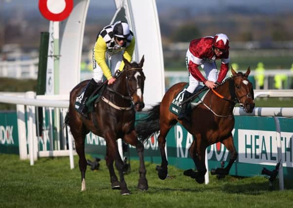 Tiger Roll (right) just holds off Pleasant Company to win last year's Grand National. Both are back for more on Saturday. (PHOTO BY: Alex Livesey/Getty Images).