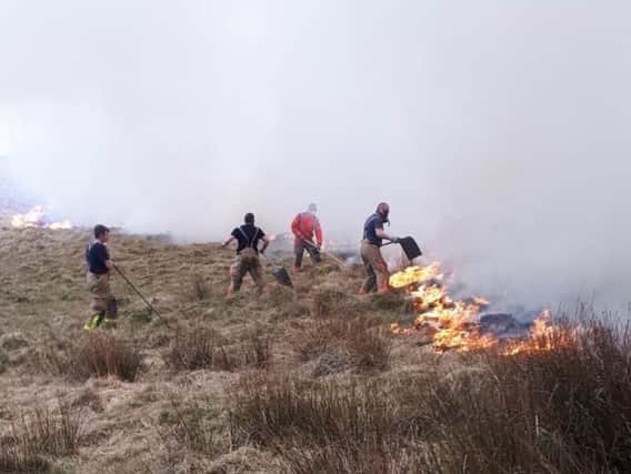 Firefighters tackling the moorland blaze at Lyme Park in Disley. Photo: Cheshire Fire & Rescue Service.
