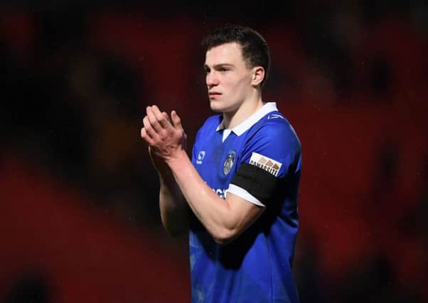 DONCASTER, ENGLAND - JANUARY 26: George Edmundson of Oldham Athletic applauds fans after the FA Cup Fourth Round match between Doncaster Rovers and Oldham Athletic at Keepmoat Stadium on January 26, 2019 in Doncaster, United Kingdom. (Photo by Laurence Griffiths/Getty Images)