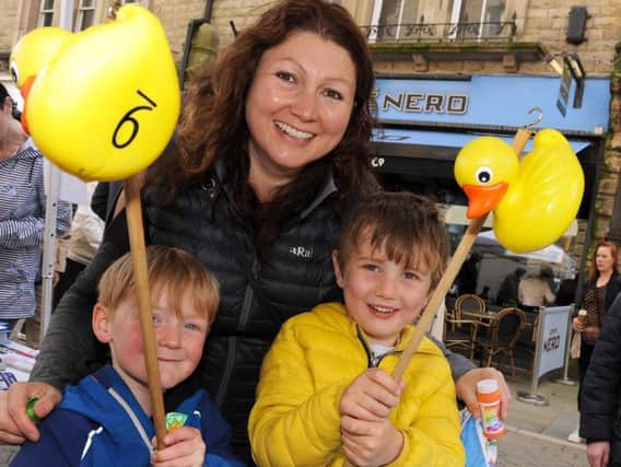 James Sheridan and Henry Goodall, both 5, prove successful on the hook a duck stall with a little help from Henry's mum Ruth.