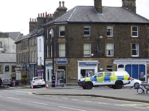 Police tape around buildings on Market Place. Picture taken by John Phillips.