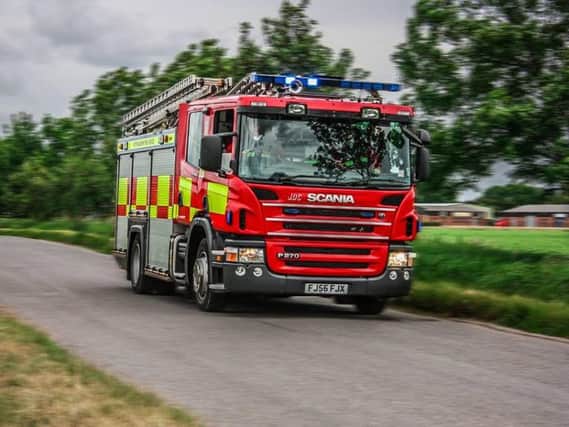 Buxton firefighters rescue man 'trapped by a car'