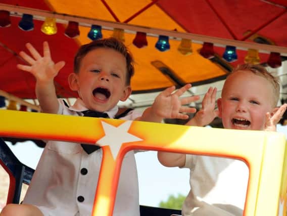 Youngsters enjoy the rides on offer.