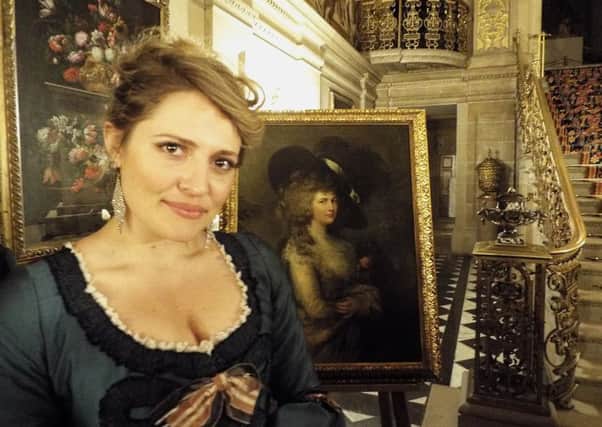 Samantha Clarke as Georgiana in Chatsworth with the portrait of the Duchess she plays.