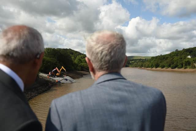 Jeremy Corbyn looks on from the walkway above the spillway of the damaged Toddbrook Reservoir dam. Photo - OLI SCARFF/AFP/Getty Images