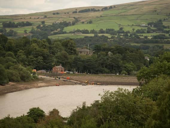 This photo shows water levels at the reservoir on Monday. Photo  - OLI SCARFF/AFP/Getty Images