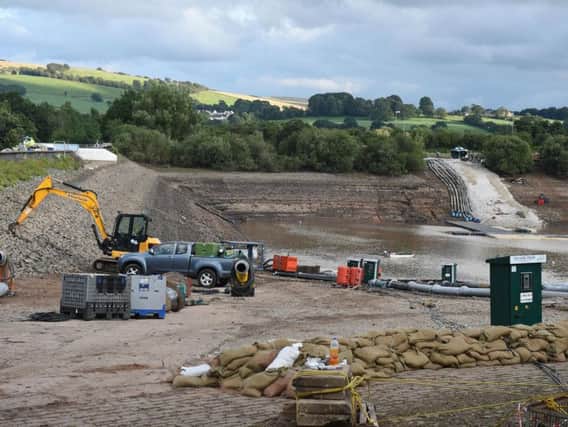 Engineers continuing their work at Toddbrook Reservoir on Wednesday. Photo - OLI SCARFF/AFP/Getty Images