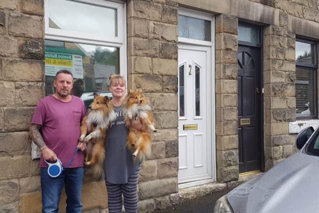 Martin and Donna Goodwin outside their home in Charles Street, Buxton, with their dogs, Bandit and Casey.