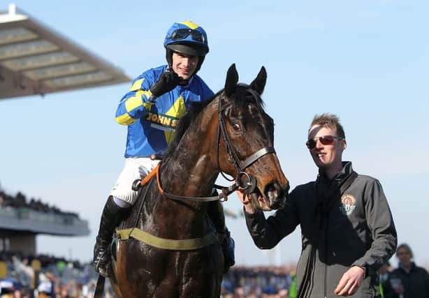 NATIONAL MANIA -- jockey Ryan Mania aboard the 66/1 Grand National winner, Auroras Encore. (PHOTO BY: David Davies/PA Wire).