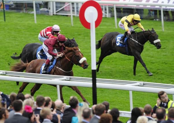 Jamie Spencer and Hot Streak (left) win the Julia Graves Roses Stakes during day four of the 2013 Yorkshire Ebor Festival at York Racecourse, York. PRESS ASSOCIATION Photo. Picture date: Saturday August 24, 2013. See PA story RACING York. Photo credit should read: John Giles/PA Wire