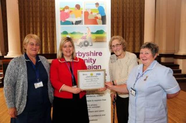 Jubilee Day Service for Older People in New Mills has been awarded a Silver Dignity Award from Derbyshire County Council. Pictured l-r Angela Eardley (Jubilee Centre manager), Derbyshire County Council Cabinet Member for Adult Social Care Councillor Clare Neill, client Ruth Waterhouse, Jubilee Centre staff member Denise Brace.