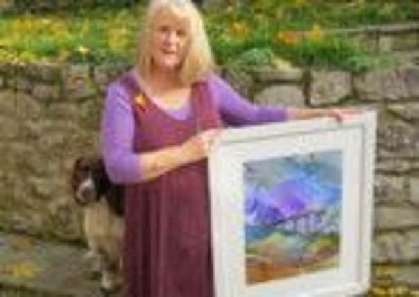 Ingrid outside her studio in Earl Sterndale with a piece from her Landmarks series Monsal Dale
