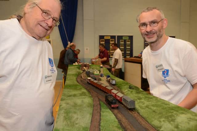 New Mills and District Railway Modellers fortieth anniversary exhibition, chairman Ian Hodgson admires the layout of fellow member Mark Howarth