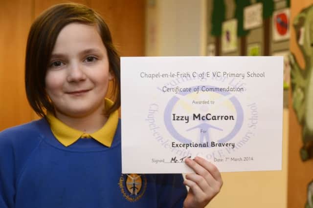 Izzy McCarron, who saved her father's life with a kick to his chest