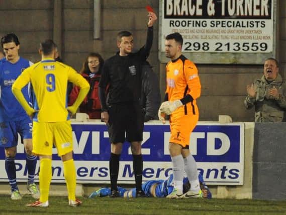 Buxton v King's Lynn. Visiting goalkeeper Ashley Timms is sent off after an altercation with Lee Morris.