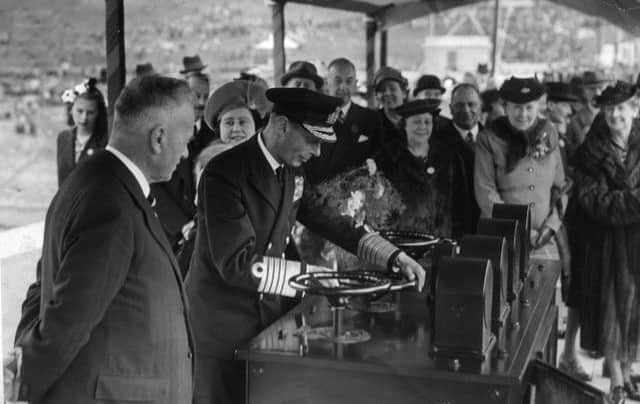 King George VI releases a valve at Ladybower Reservoir during its inauguration in 1945. Photo: Sheffield Newspapers.
