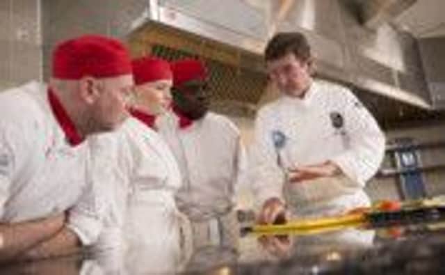 Rob Stordy (right) in the kitchen with students.