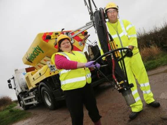 Councillor Joan Dixon with the Jetpatcher machine which has been hired by Derbyshire County Council to fix potholes on the county's roads.
