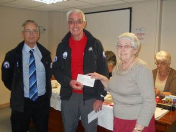 Chapel WI present hand over a cheque to Buxton Mountain Rescue Team. Photo contributed.
