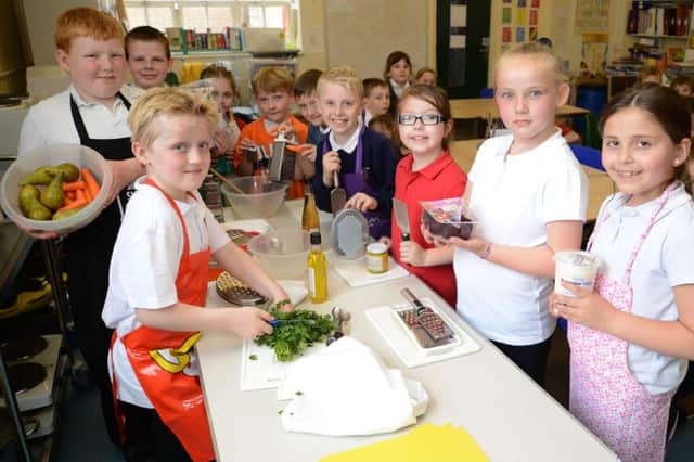 Year three and four pupils at St Georges New Mills taking part in Jamie Olivers Big Cook Off