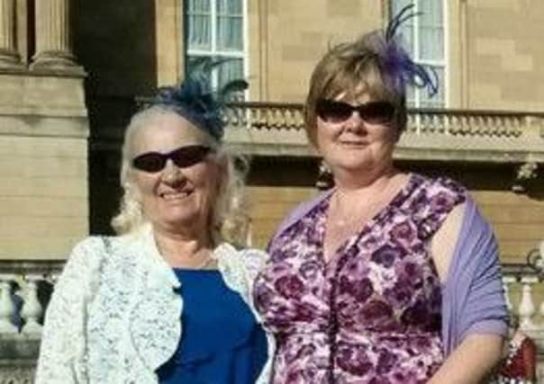New Mills CAB volunteer Lynda Belfield, right, with her mum Margaret Belfield, at a garden party at Buckingham Palace. Photo contributed.