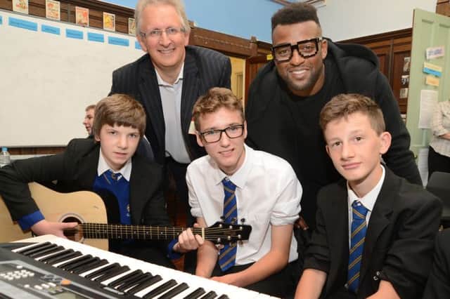 Ortise of JLS and MP Andrew Bingham at the music industry mentoring day at Glossopdale Community College, with Seb Brass, Bobby Turton, Jamie Rowbotham and Lewis Ley