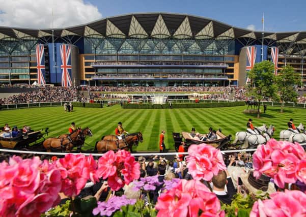 FIT FOR A QUEEN -- the scene at spectacular Royal Ascot as the royal procession arrives for the final day. (PHOTO BY: Dominic Lipinski/PA Wire)