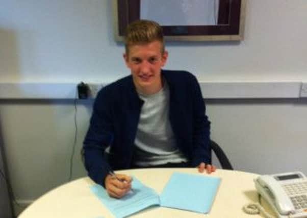 Dan Cowan, of Taddington, signs his pro deal with Macclesfield Town.