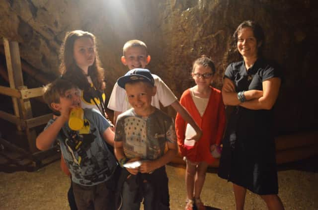 The stars of High Peak Community Arts' Blue John with musician Caro Churchill get into character at Treak Cliff Cavern. Photo contributed.