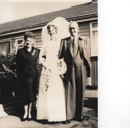 Thomas Marsh with his wife, May, and granddaughter Diana Darlington on  her wedding day in 1964. Photo contributed.