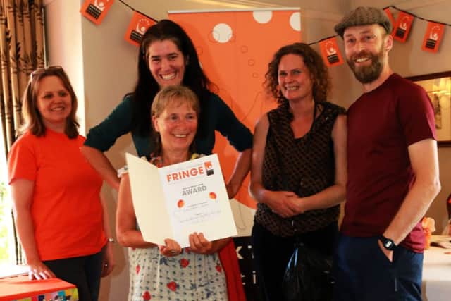 Susannah Thompson, Isla Elford, Chris Robinson and Ruby Moon collect the award for the Grinlow Art and Storytelling Trail from Fringe Marketing Officer Stephanie Billen. Photo: Ian J Parkes.