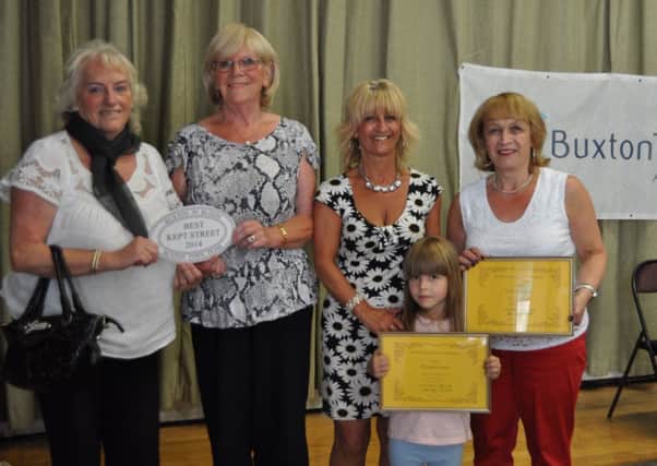 Maria Birchenough and the residents of Dovedale Crescent with their Best Street award. Photo: Jason Darley.