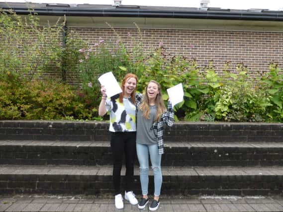 Emily Brooks and Ella Peatfield, of New Mills School, celebrate their A-level results. Photo contributed.