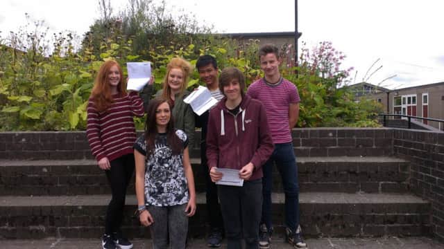 New Mills School pupils celebrate their GCSE results.
