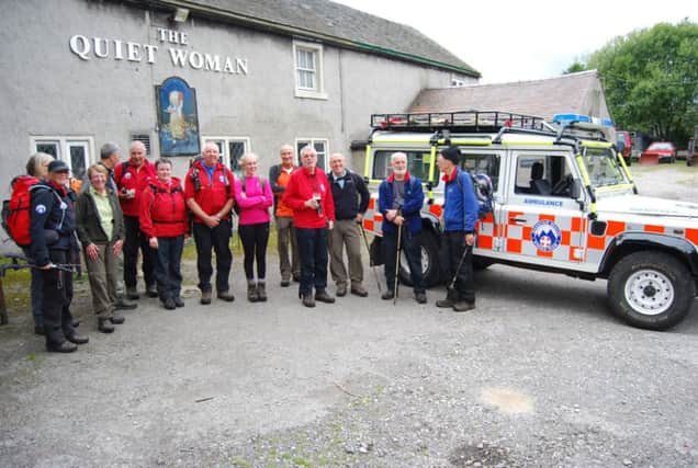 David Coleman (third from the right) with mountain rescue personnel and friends at the The Quiet Woman, Earl Sterndale. Photo contributed.