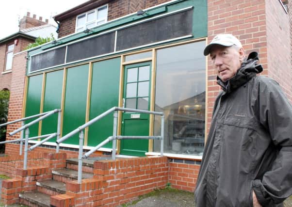 NEAALM101103D1 - Eastwood. Brian Fretwell outside his old shop on South Street