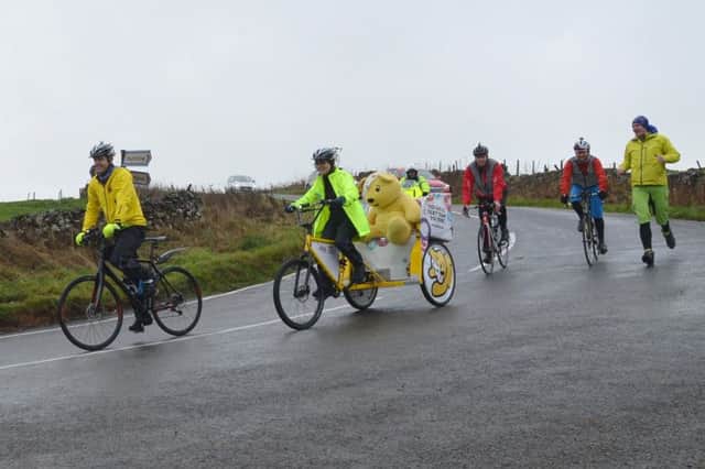 Matt Baker leads the BBC Rickshaw Challenge through the Peak District