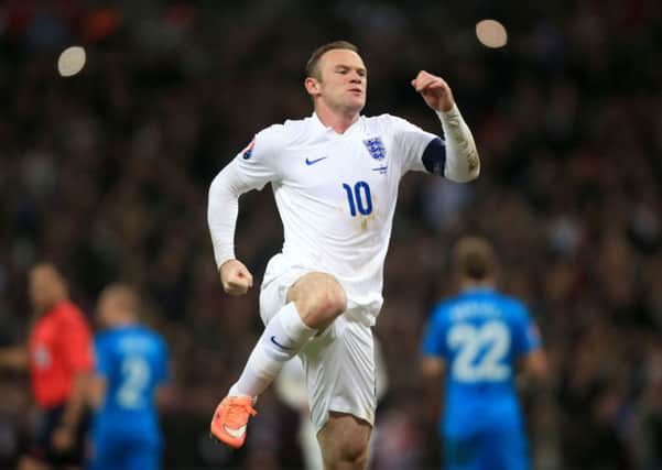 England's Wayne Rooney celebrates scoring his side's first goal of the game from the penalty spot during the UEFA Euro 2016 Group E Qualifying match at Wembley Stadium.