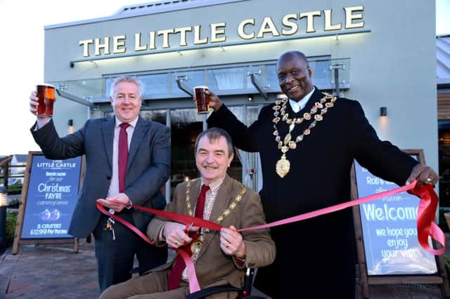 Derbyshire County Council Chairman Councillor Steve Freeborn, centre, officially opens The Little Castle with Mayor of Chesterfield Councillor Alexis Diouf, right, and manager Rob Freeman.